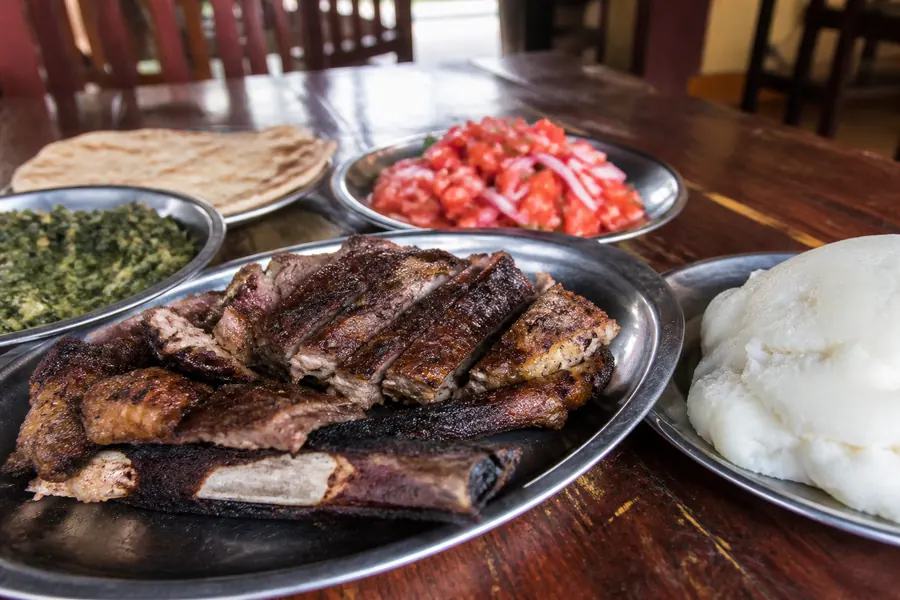 Authentic Kenyan BBQ with nyama choma, ugali and kachumbari